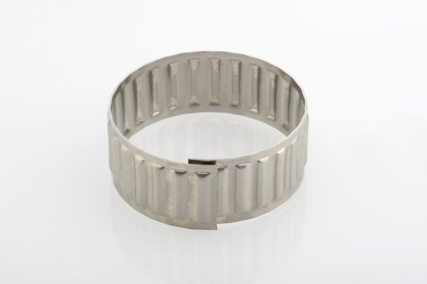 Metallischer Wellrippen-Ring von Dr. TRETTER für lineare Bewegungen.